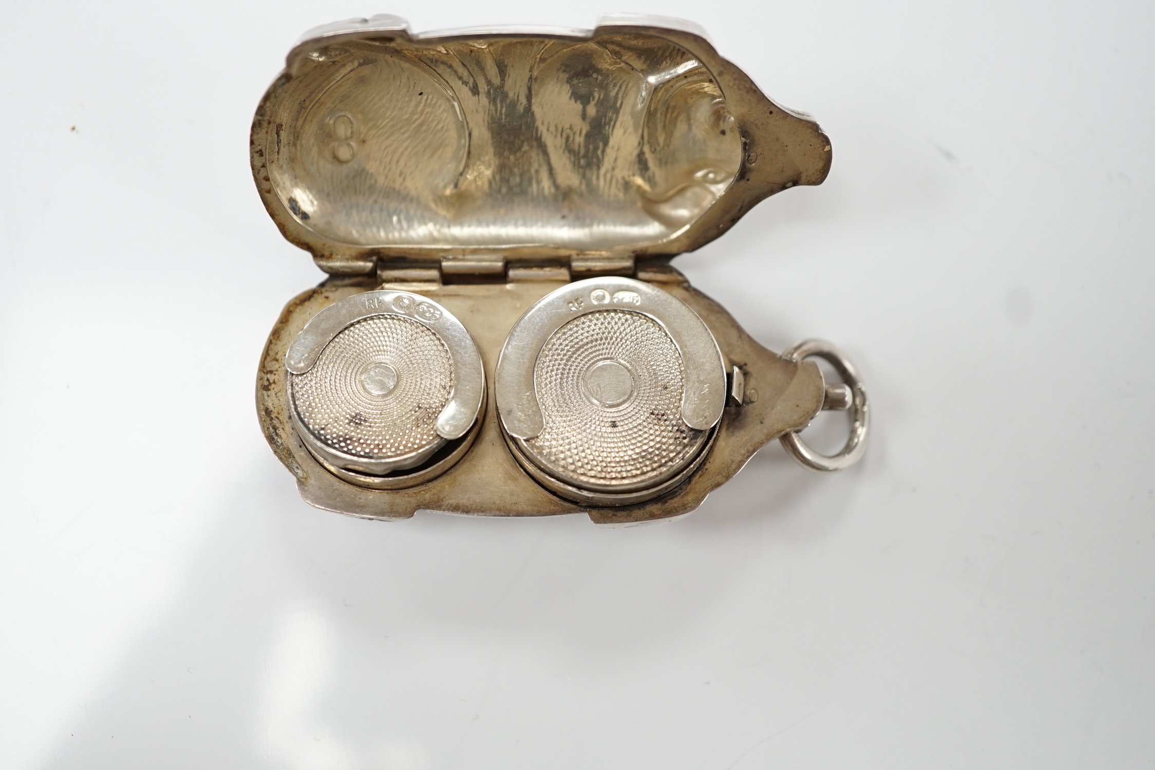 An Edwardian novelty silver sovereign/half sovereign case, modelled as a pig, import marks for Robert Friederich, London, 1905, 63mm.